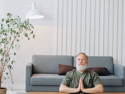 Man meditating or relaxing at home